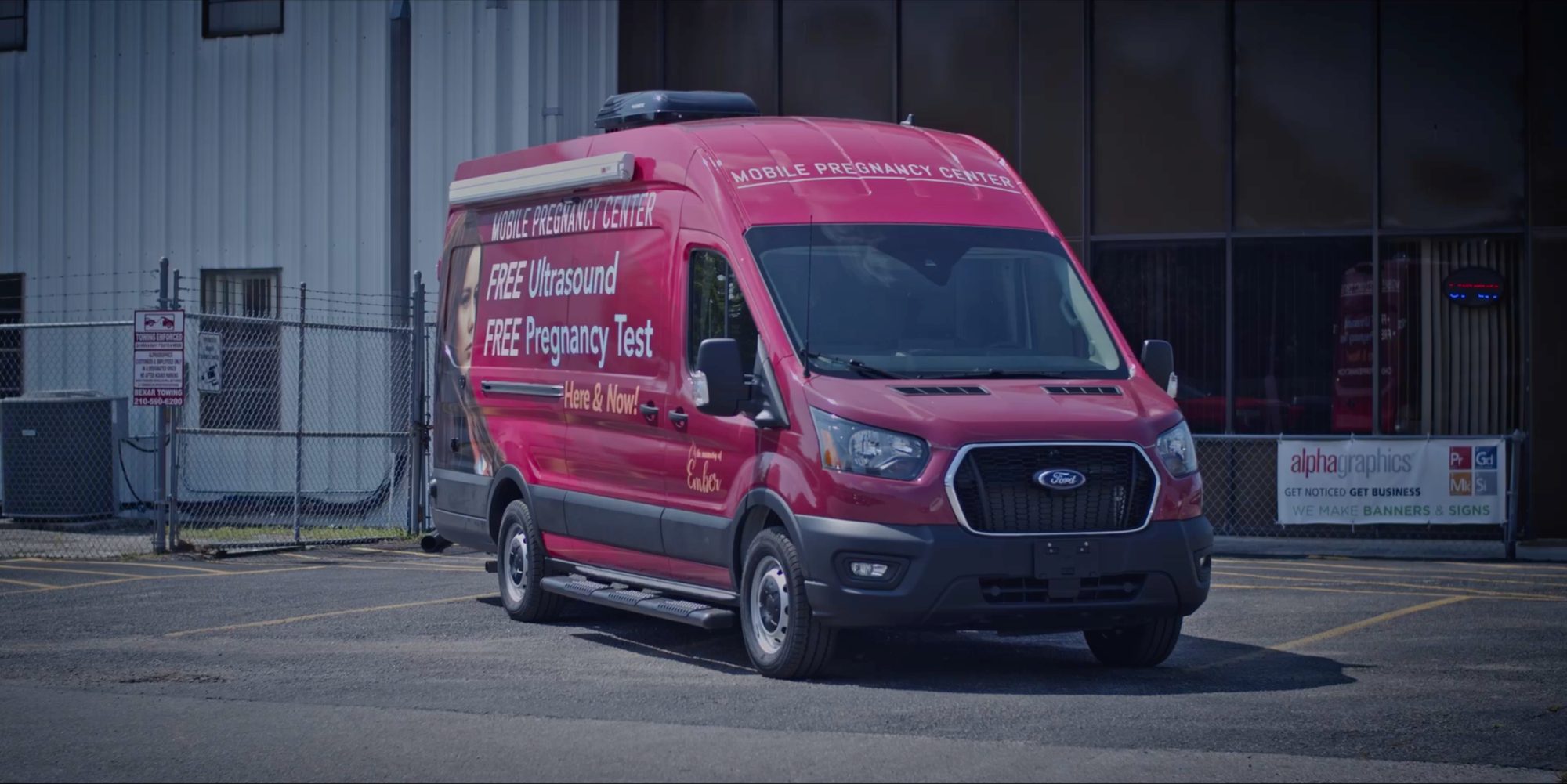 A Vans for Life van parked outside a facility
